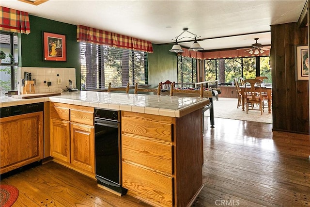 361 Riviera Dr, Lake Arrowhead, CA 92352 - kitchen featuring ceiling fan, healthy amount of natural light, dark wood finished floors, and decorative backsplash