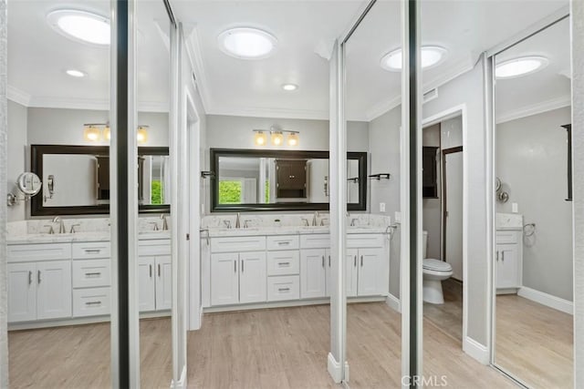28205 Zurburan, Mission Viejo, CA 92692 - bathroom featuring ornamental molding, double vanity, and wood finished floors