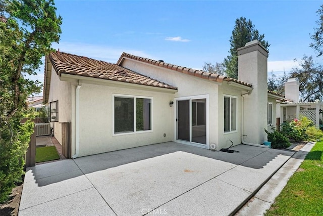 28205 Zurburan, Mission Viejo, CA 92692 - back of house with stucco siding, a patio area, a chimney, and a tile roof