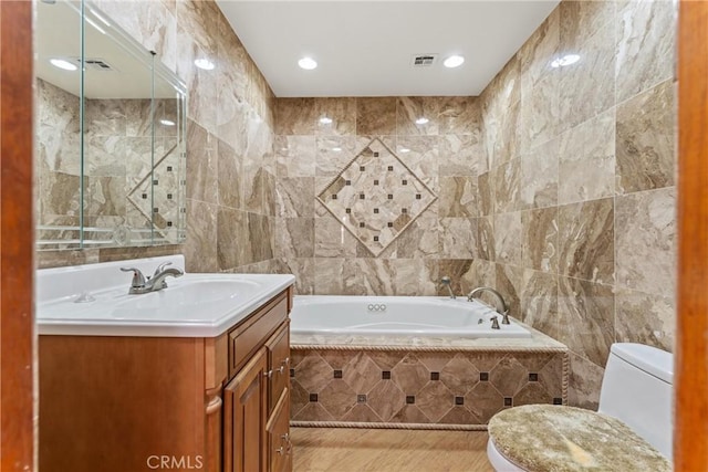 41127 17th St W, Palmdale, CA 93551 - bathroom with tile walls, vanity, a bath, and recessed lighting