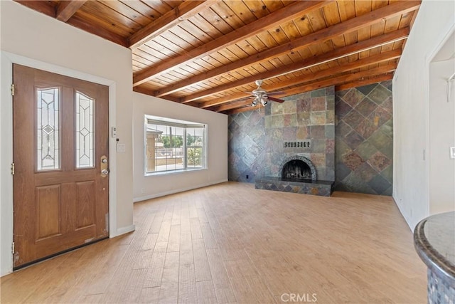 41127 17th St W, Palmdale, CA 93551 - foyer entrance featuring a wooden ceiling with exposed beams, wood finished floors, a ceiling fan, and a fireplace