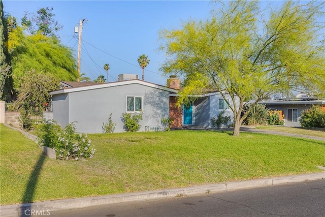 26919 Villa Ave, Highland, CA 92346 - ranch-style home featuring stucco siding, a chimney, and a front lawn