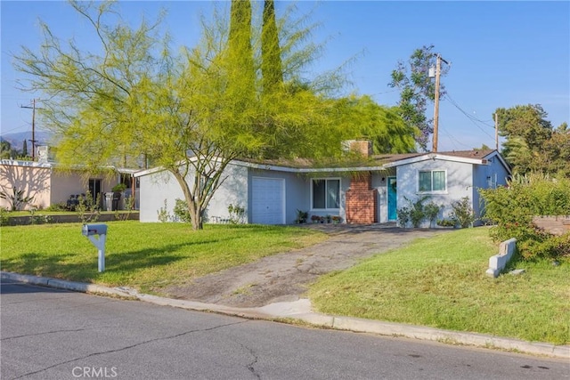 26919 Villa Ave, Highland, CA 92346 - ranch-style house with a front lawn, stucco siding, and driveway