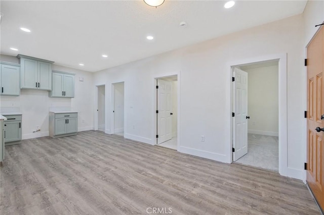 221 N Orchard St, Fresno, CA 93701 - unfurnished living room with light wood-style flooring and recessed lighting