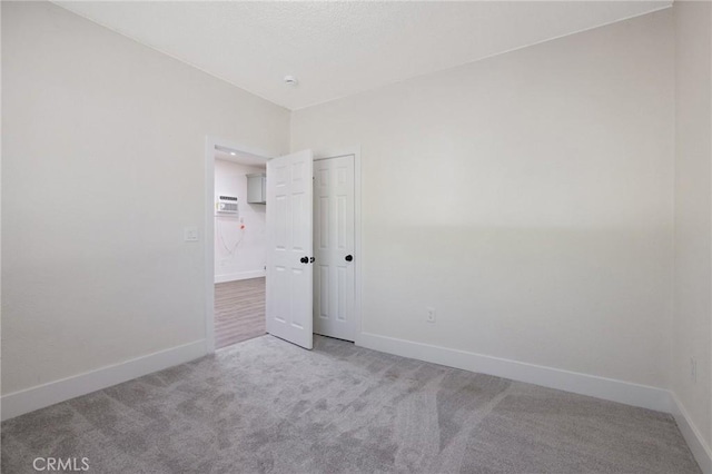 221 N Orchard St, Fresno, CA 93701 - carpeted spare room with a wall mounted AC and a smoke detector