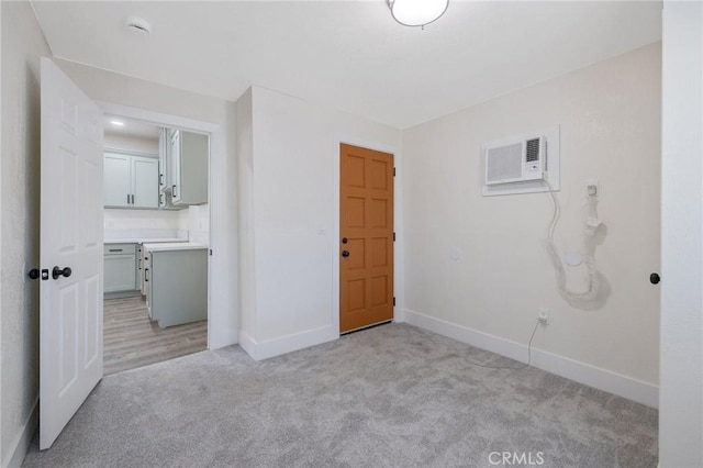221 N Orchard St, Fresno, CA 93701 - unfurnished bedroom featuring light carpet and a wall unit AC