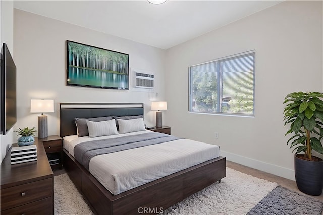 221 N Orchard St, Fresno, CA 93701 - bedroom featuring baseboards and an AC wall unit