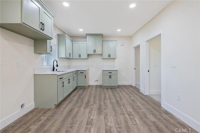 221 N Orchard St, Fresno, CA 93701 - kitchen with light wood-style flooring, recessed lighting, and light countertops