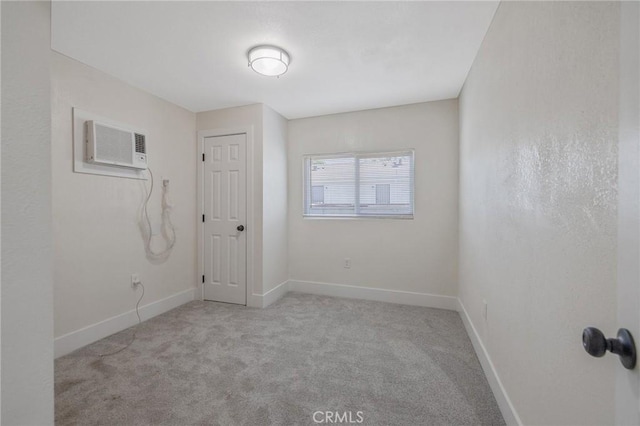 221 N Orchard St, Fresno, CA 93701 - carpeted empty room with a wall mounted air conditioner and baseboards
