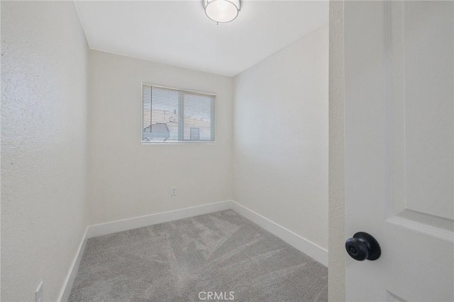 221 N Orchard St, Fresno, CA 93701 - empty room featuring carpet flooring and baseboards