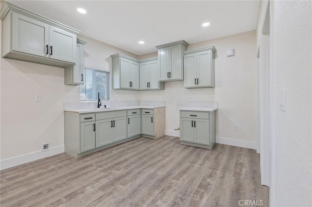 221 N Orchard St, Fresno, CA 93701 - kitchen featuring light wood-type flooring, gray cabinetry, and recessed lighting