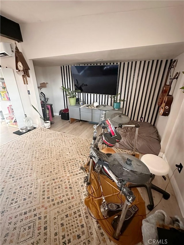 10623 4th Ave, Hesperia, CA 92345 - interior space featuring wood finished floors and a wall unit AC