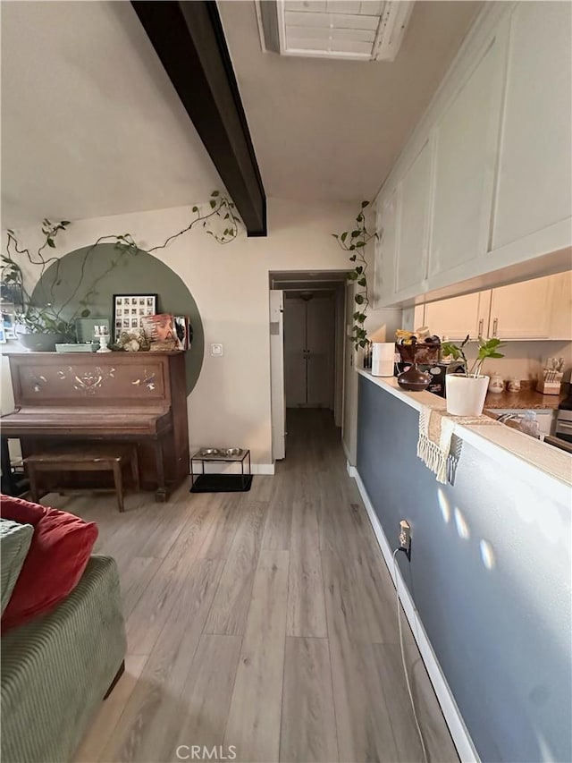 10623 4th Ave, Hesperia, CA 92345 - interior space featuring light wood-type flooring and beamed ceiling