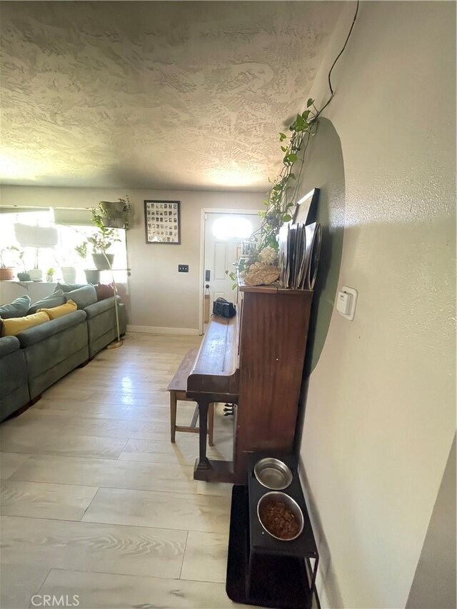 10623 4th Ave, Hesperia, CA 92345 - hall featuring a textured ceiling and baseboards