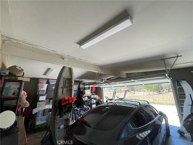 10623 4th Ave, Hesperia, CA 92345 - garage featuring a garage door opener
