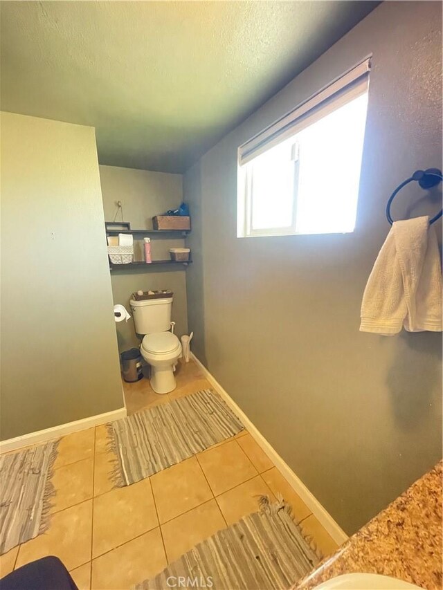10623 4th Ave, Hesperia, CA 92345 - bathroom featuring tile patterned flooring, vanity, and a textured ceiling