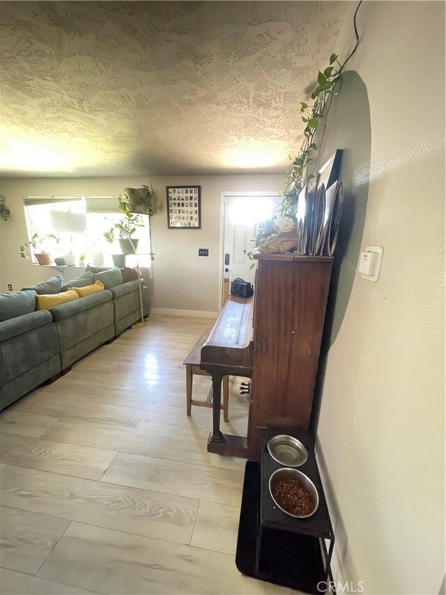 10623 4th Ave, Hesperia, CA 92345 - hall featuring a textured ceiling