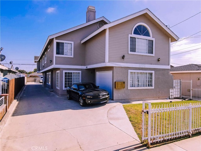 1726 W 150th St Unit 1, Gardena, CA 90247 - view of front facade featuring concrete driveway, an attached garage, a chimney, and stucco siding