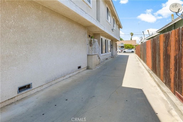 1726 W 150th St Unit 1, Gardena, CA 90247 - view of side of property with stucco siding, crawl space, and a patio area