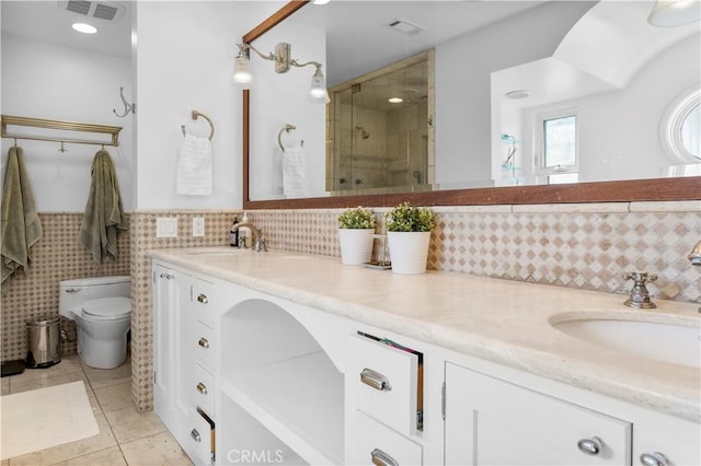 1726 W 150th St Unit 1, Gardena, CA 90247 - bathroom featuring double vanity, a stall shower, tile patterned floors, and wainscoting