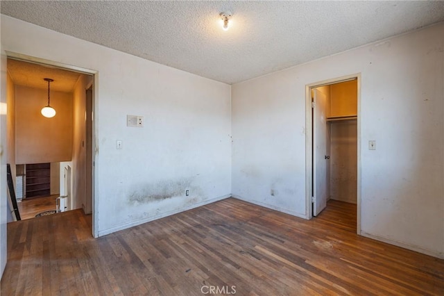 17300 Buttonwood St, Fountain Valley, CA 92708 - empty room with wood finished floors and a textured ceiling