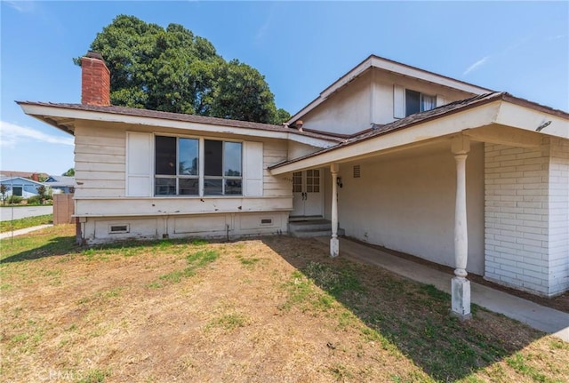 17300 Buttonwood St, Fountain Valley, CA 92708 - split level home featuring a chimney, crawl space, a front yard, and entry steps
