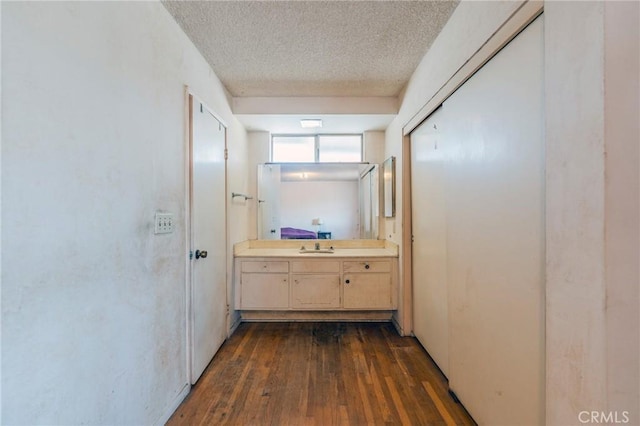 17300 Buttonwood St, Fountain Valley, CA 92708 - hall featuring a textured ceiling and dark wood finished floors