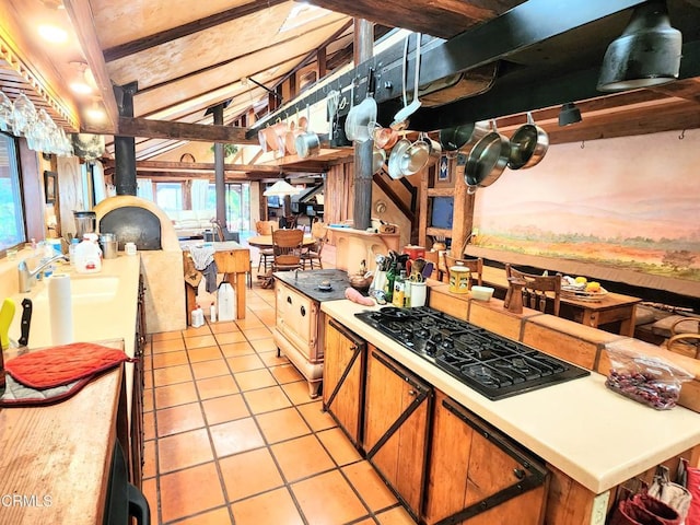 31351 Comptche Ukiah Rd, Comptche, CA 95427 - kitchen with black gas cooktop, healthy amount of natural light, light tile patterned floors, and light countertops