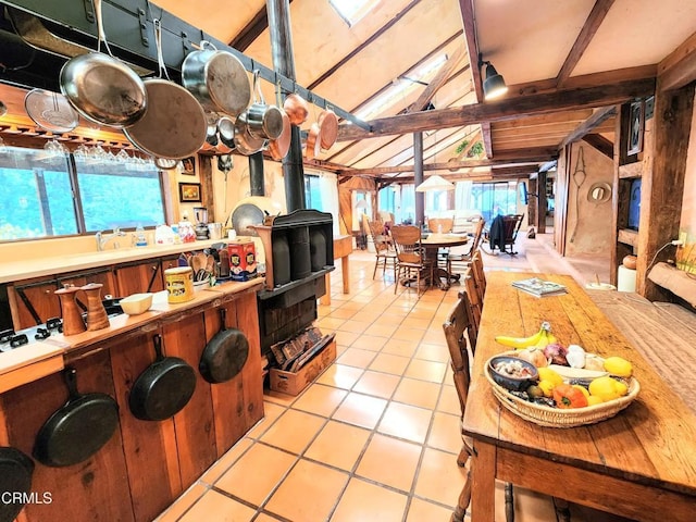 31351 Comptche Ukiah Rd, Comptche, CA 95427 - kitchen featuring light tile patterned floors, a wood stove, and light countertops