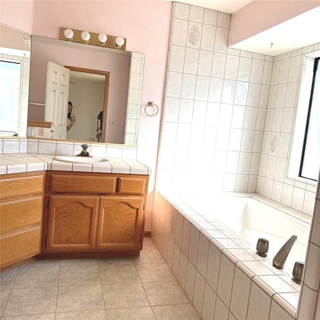 9078 Smith Rd, Phelan, CA 92371 - full bath featuring tiled tub, vanity, and tile patterned flooring