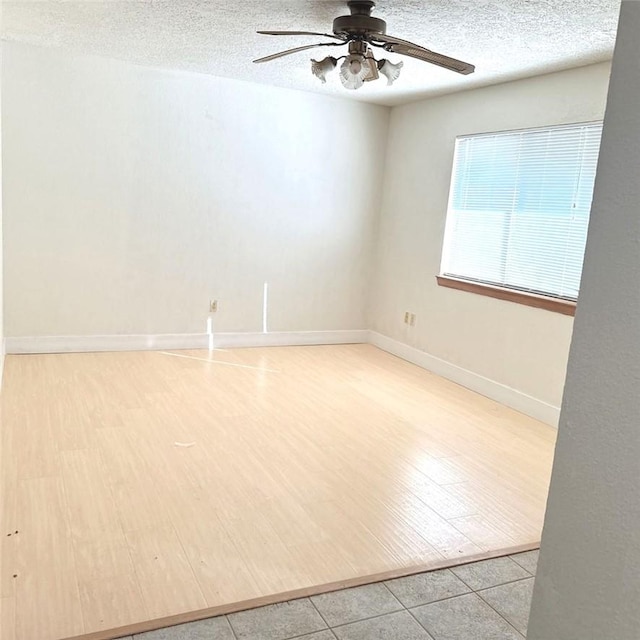 9078 Smith Rd, Phelan, CA 92371 - spare room with a ceiling fan, a textured ceiling, and wood finished floors