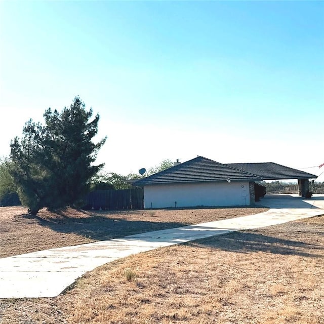 9078 Smith Rd, Phelan, CA 92371 - view of side of home featuring concrete driveway