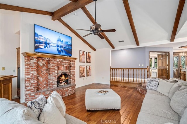 5908 Alleppo Ln, Palmdale, CA 93551 - living room with a ceiling fan, beam ceiling, wood-type flooring, a fireplace, and high vaulted ceiling