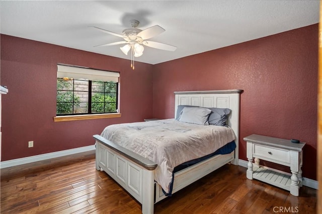 5908 Alleppo Ln, Palmdale, CA 93551 - bedroom featuring dark wood-style flooring, a textured wall, and ceiling fan