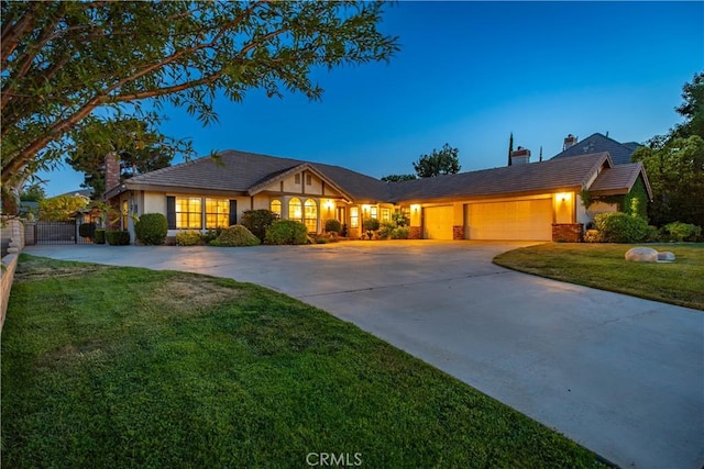 5908 Alleppo Ln, Palmdale, CA 93551 - view of front of house featuring a chimney, driveway, a garage, and stucco siding