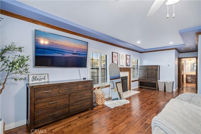 5908 Alleppo Ln, Palmdale, CA 93551 - bedroom with a fireplace with raised hearth, crown molding, dark wood-style floors, and recessed lighting