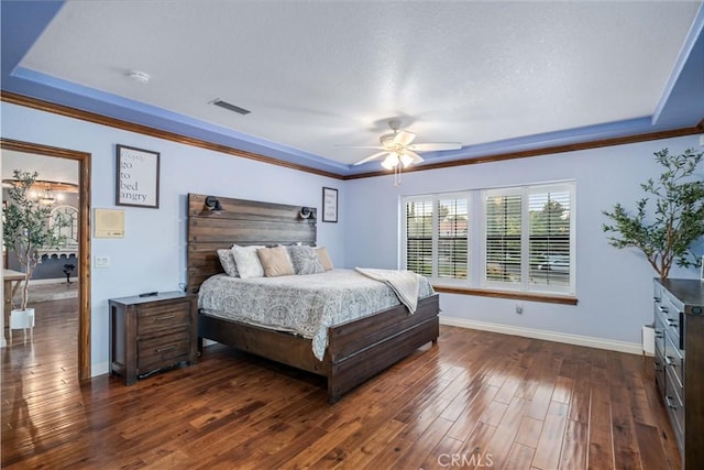 5908 Alleppo Ln, Palmdale, CA 93551 - bedroom with a raised ceiling, dark wood-style flooring, crown molding, ceiling fan, and a textured ceiling