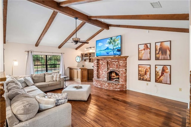 5908 Alleppo Ln, Palmdale, CA 93551 - living room featuring hardwood / wood-style floors, beamed ceiling, a brick fireplace, a ceiling fan, and high vaulted ceiling