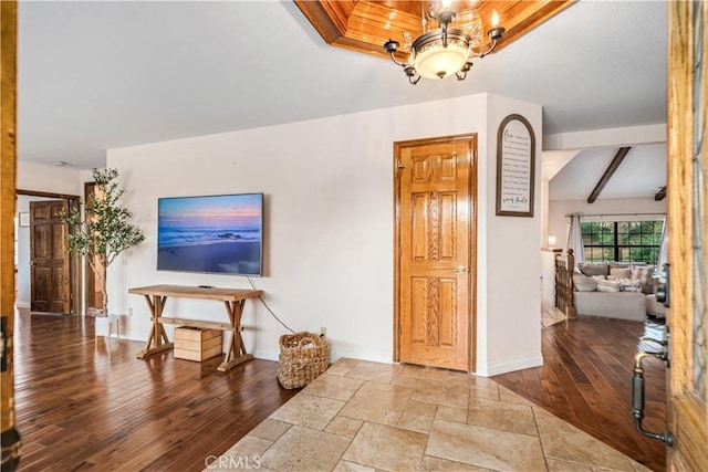 5908 Alleppo Ln, Palmdale, CA 93551 - living room with a chandelier, wood finished floors, and beamed ceiling