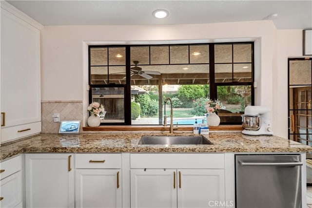 5908 Alleppo Ln, Palmdale, CA 93551 - kitchen featuring white cabinetry, stainless steel dishwasher, light stone countertops, and a ceiling fan