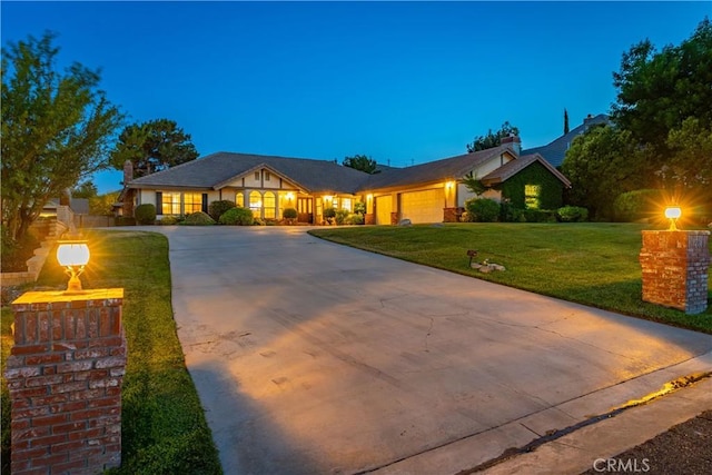 5908 Alleppo Ln, Palmdale, CA 93551 - view of front facade with a garage, concrete driveway, and a front lawn