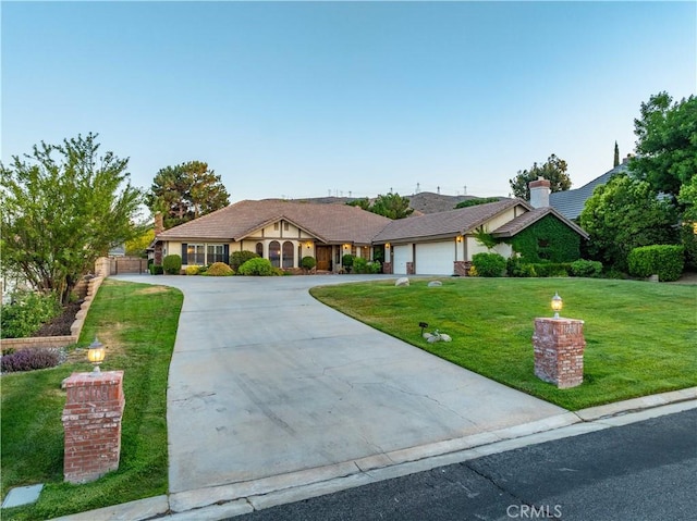 5908 Alleppo Ln, Palmdale, CA 93551 - view of front of property with driveway, a front lawn, and a garage