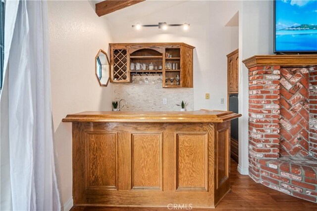 5908 Alleppo Ln, Palmdale, CA 93551 - indoor wet bar with backsplash and dark wood-style flooring