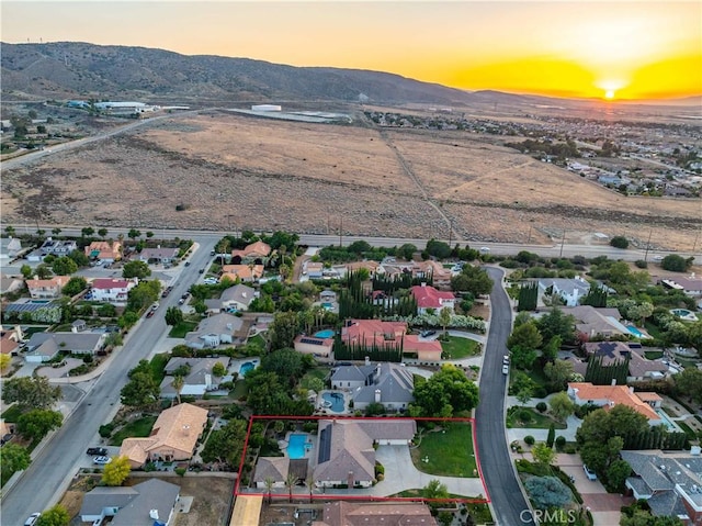5908 Alleppo Ln, Palmdale, CA 93551 - aerial view at dusk of a mountain view, property boundaries highlighted, and a residential view