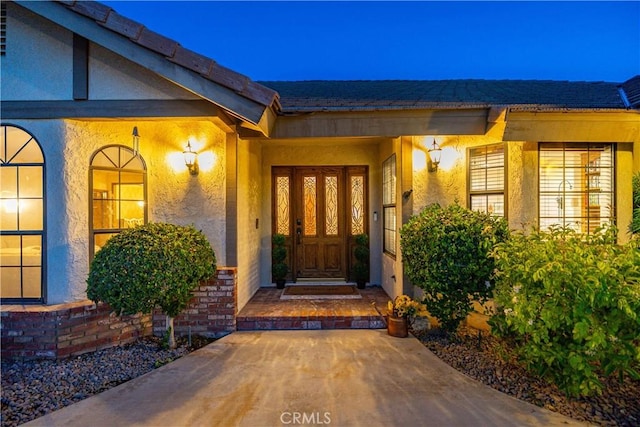 5908 Alleppo Ln, Palmdale, CA 93551 - doorway to property featuring stucco siding