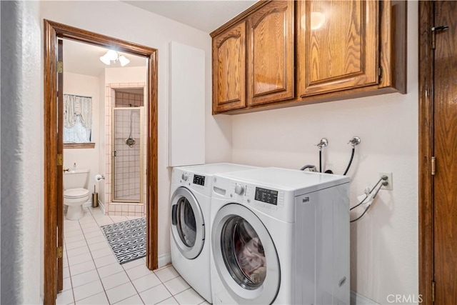 5908 Alleppo Ln, Palmdale, CA 93551 - laundry area featuring cabinet space, light tile patterned flooring, and independent washer and dryer