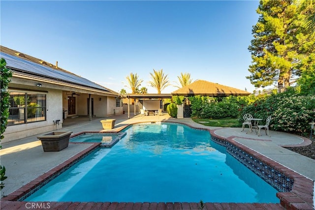 5908 Alleppo Ln, Palmdale, CA 93551 - view of swimming pool featuring a patio area, ceiling fan, and a pool with connected hot tub