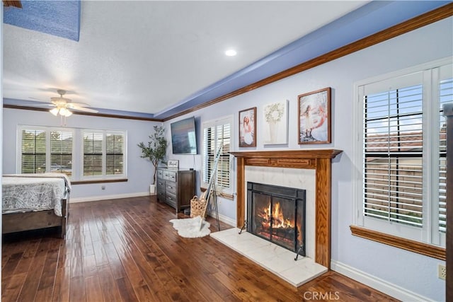 5908 Alleppo Ln, Palmdale, CA 93551 - bedroom featuring a fireplace, dark wood-type flooring, and crown molding