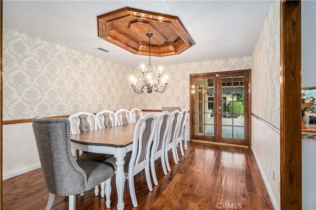 5908 Alleppo Ln, Palmdale, CA 93551 - dining area featuring wallpapered walls, a tray ceiling, hardwood / wood-style flooring, french doors, and a chandelier