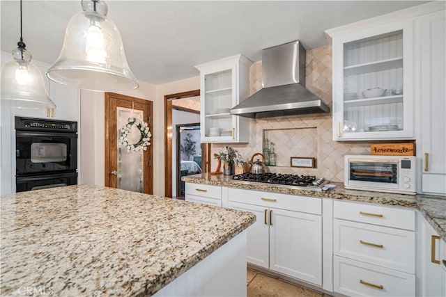 5908 Alleppo Ln, Palmdale, CA 93551 - kitchen with wall chimney exhaust hood, stainless steel gas cooktop, backsplash, light stone counters, and white cabinets
